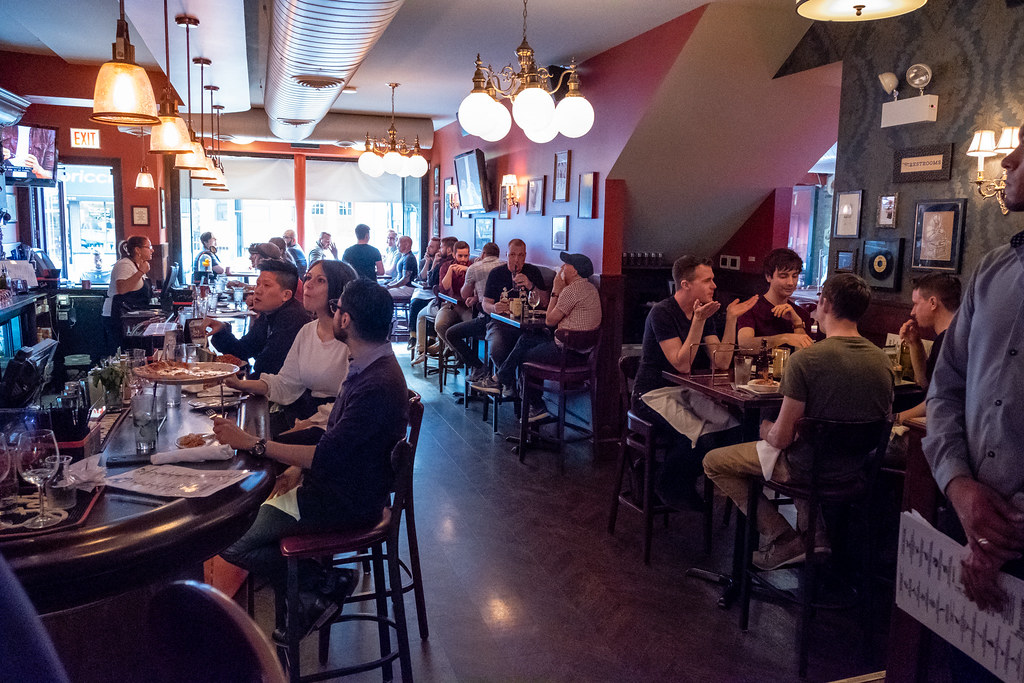 Family and friends enjoying dinner in a warm restaurant setting